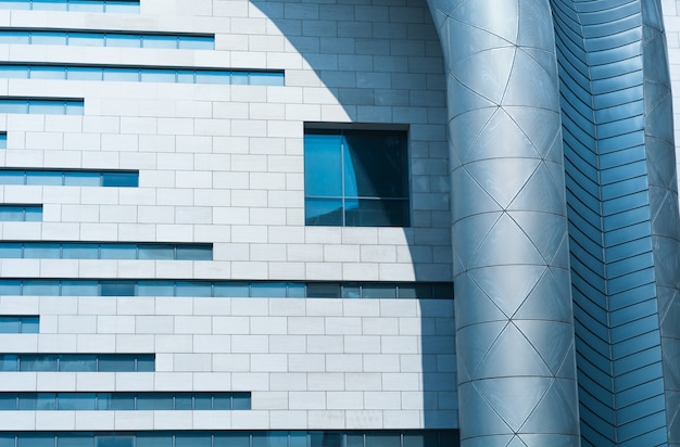 Free photo building facade with a window and a ventilation pipe