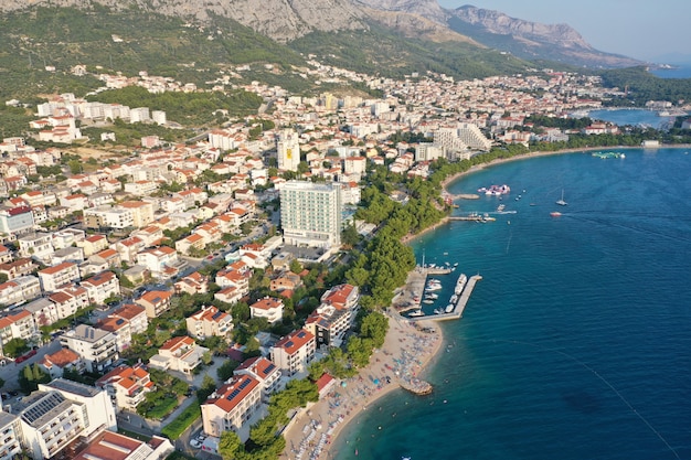 Buildings and houses near the sea and mountains in Makarska, Croatia