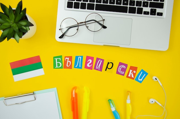 Free photo bulgarian flag and lettering on yellow background