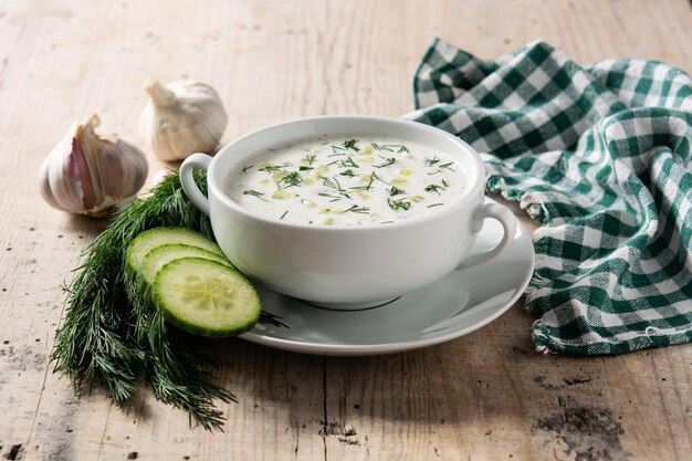 Bulgarian tarator sour milk soup on wooden table