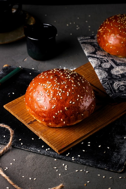 Free photo bun with sesame on the table