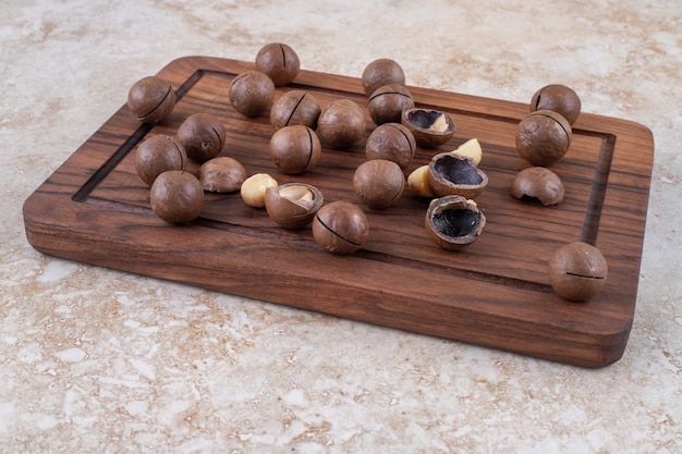 Bunch of chocolate candies on wooden board