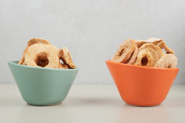 Bunch of dried fruit slices in bowls