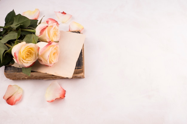 Bunch of fresh flowers and vintage book