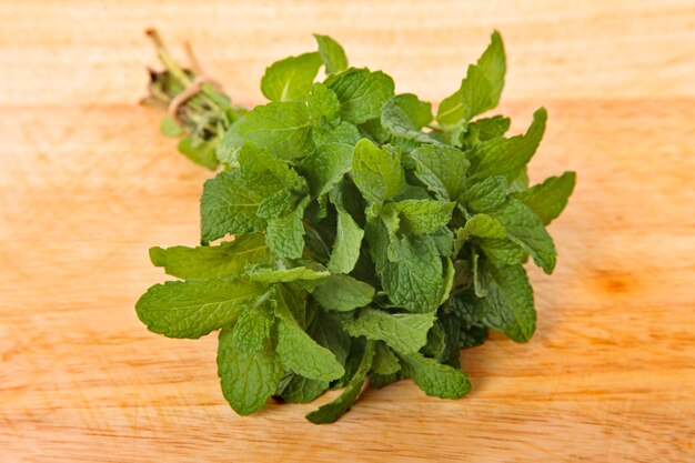 Bunch of fresh mint on wooden board