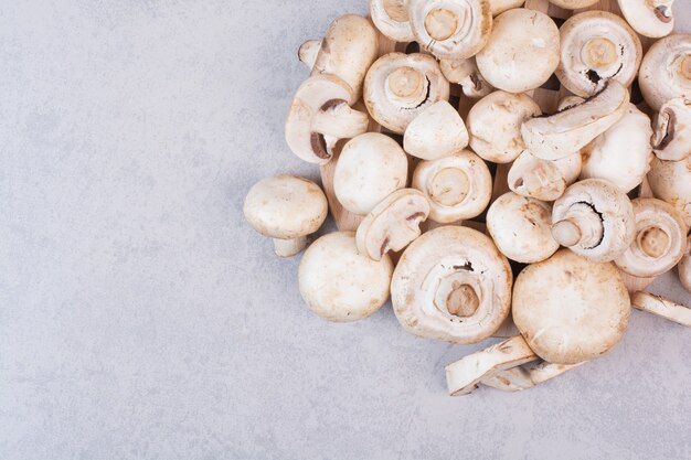 Bunch of fresh mushrooms on stone surface