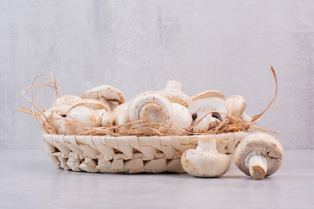 Bunch of fresh mushrooms in wooden basket