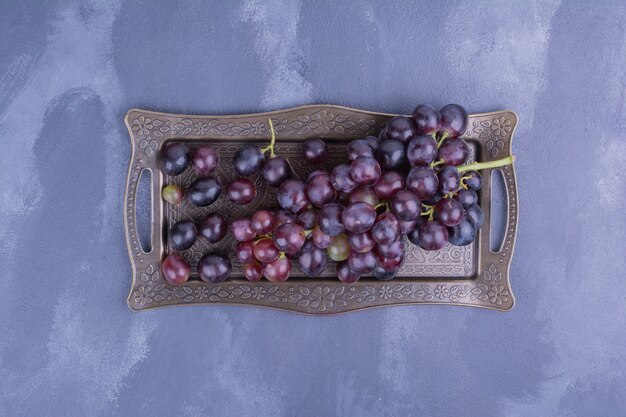 Bunch of grape in a metallic tray