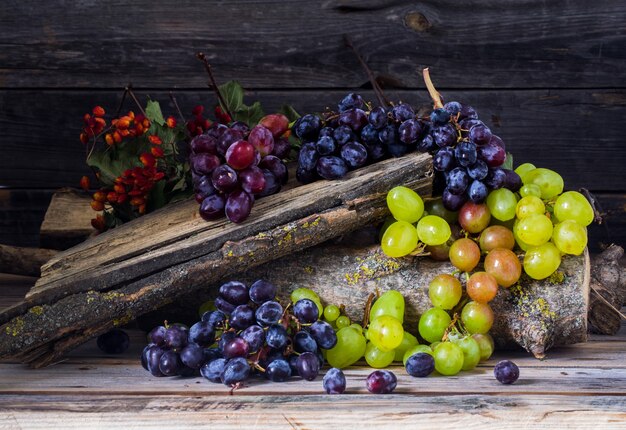 bunch of grapes on wooden table