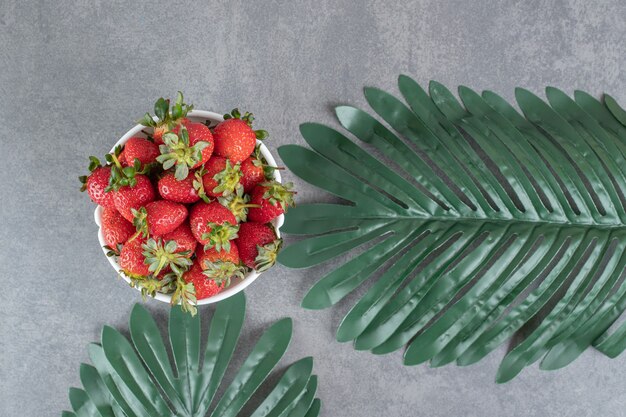 Bunch of red strawberries in white bowl. High quality photo