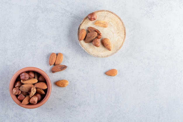 Bunch of tasty organic almond kernels on stone.