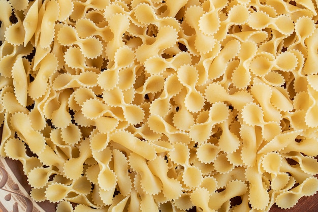 Bunch of uncooked pasta in close up view.