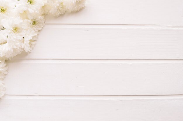 Bunch of white flowers on wood