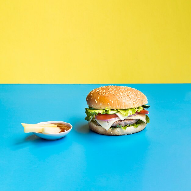 Burger on blue and yellow background