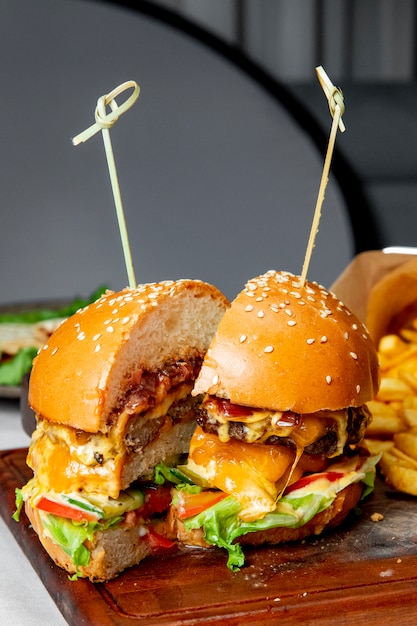 Burger with meat cutlet tomatoes lettuce and cheese