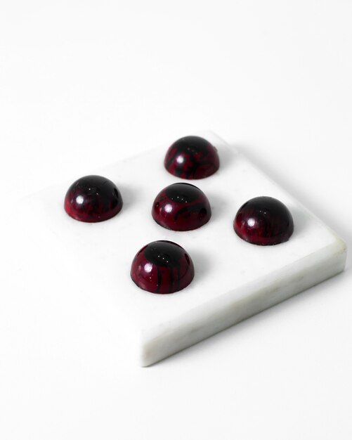 Burgundy choco candies art designed tasty whole isolated on the white floor