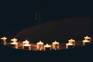 Free photo burning candles in the bathroom in the dark