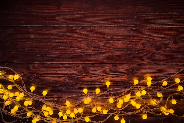 Burning garland on brown table