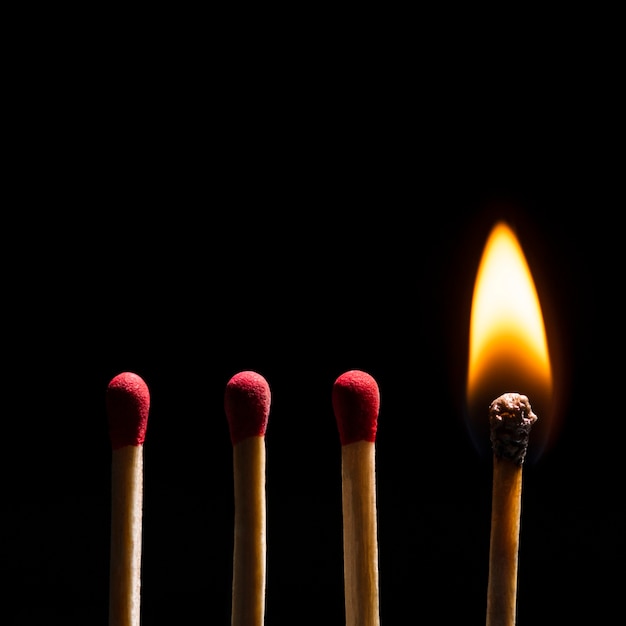 Free photo burning matches flame, black border background high resolution image