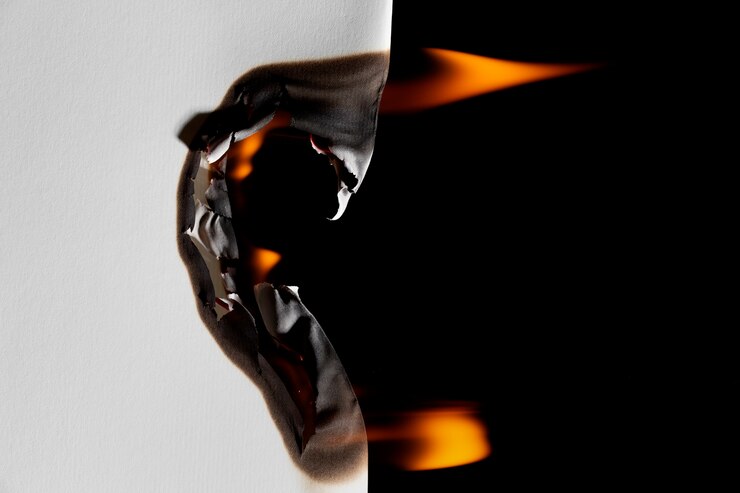 Free Photo burning paper background still life