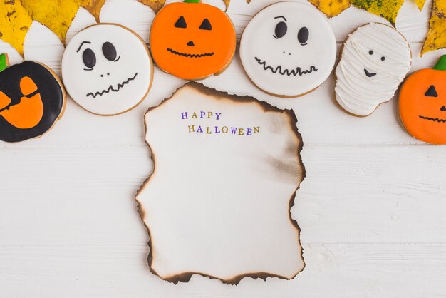 Burning paper under gingerbread and foliage