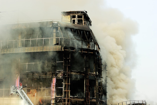 Burning shopping center or mall with smoke