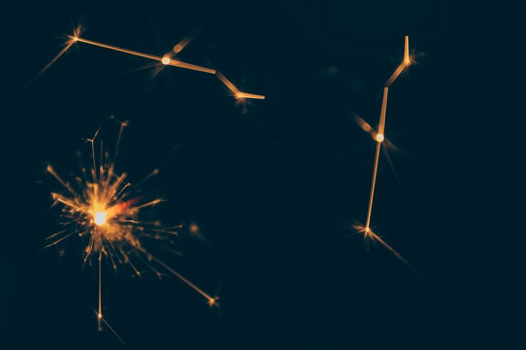 Free Photo burning sparkler on dark backdrop