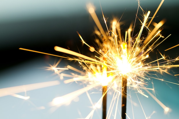 Free photo burning sparklers in night