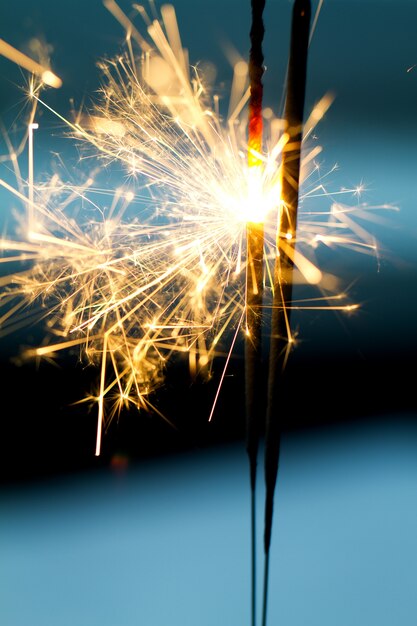 Burning sparklers in night