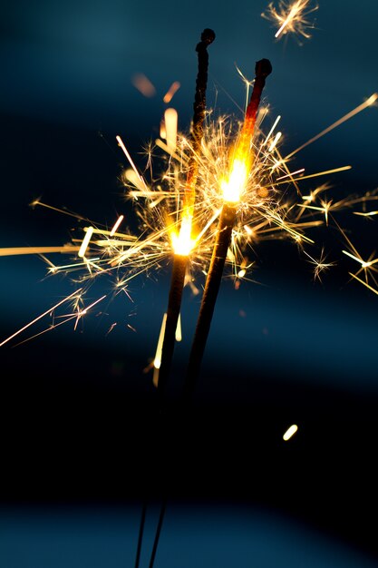 Burning sparklers in night