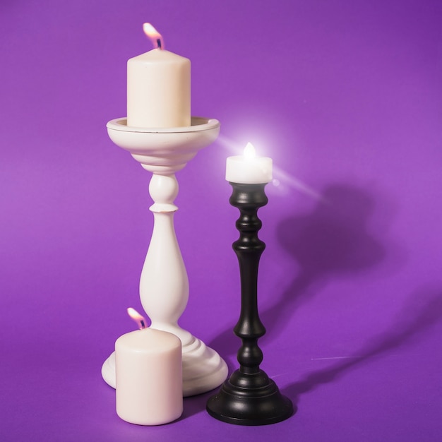 Free photo burning white candles on mounts