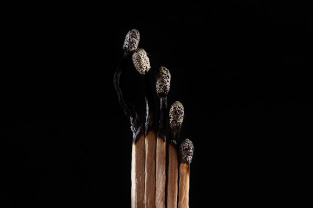 Burnt matches with dark background