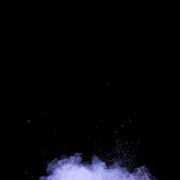 Burst of vibrant makeup powder on dark background