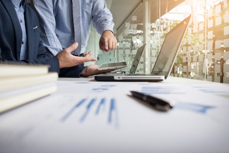Free Photo business adviser analyzing financial figures denoting the progress in the work of the company.
