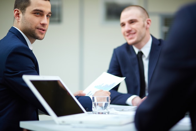 Business adviser analyzing a report