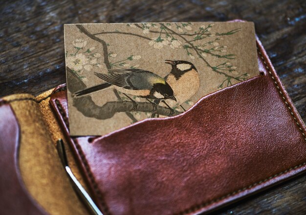 Business card with birds in a wallet