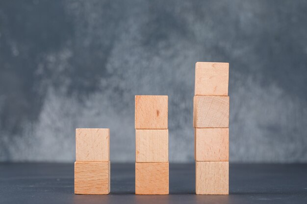 Business chart and employment concept with wooden blocks as chart side view.