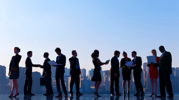 Free photo business colleagues at a rooftop talking