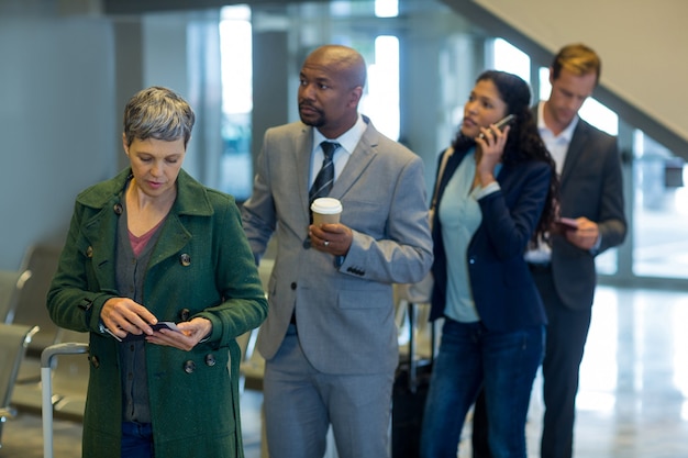 Business commuters waiting in queue