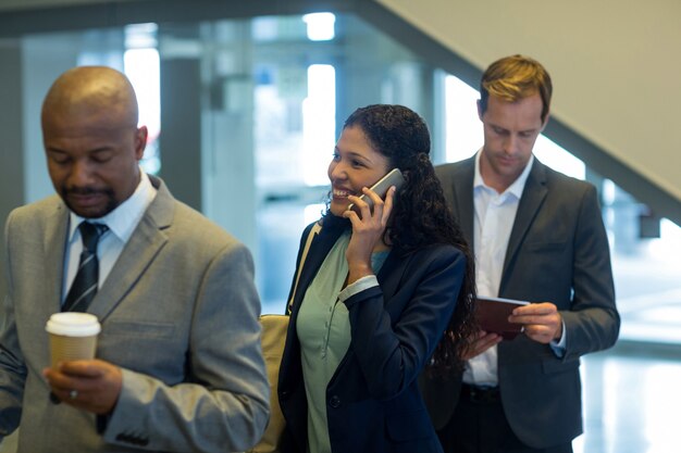 Business commuters waiting in queue