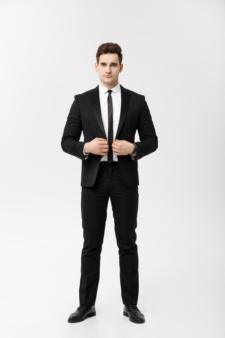 Free Photo business concept: handsome man happy smile young handsome guy in smart suit posing over isolated grey background.