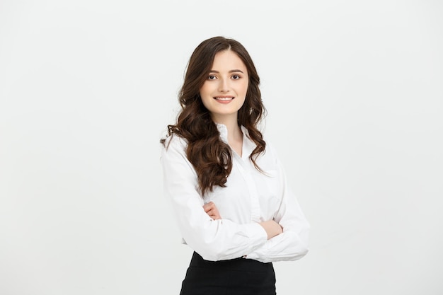 Business concept portrait confident young businesswoman keeping arms crossed and looking at camera w