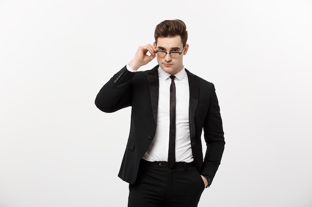 Business Concept: Portrait handsome young businessman wearing glasses isolated over white background