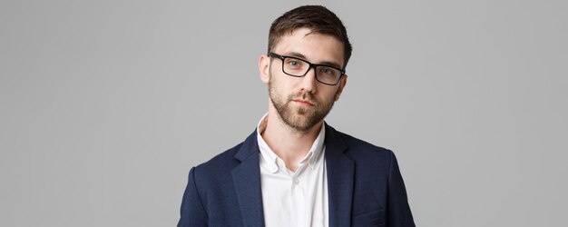 Business Concept portrait young successful businessman posing over dark background Copy space