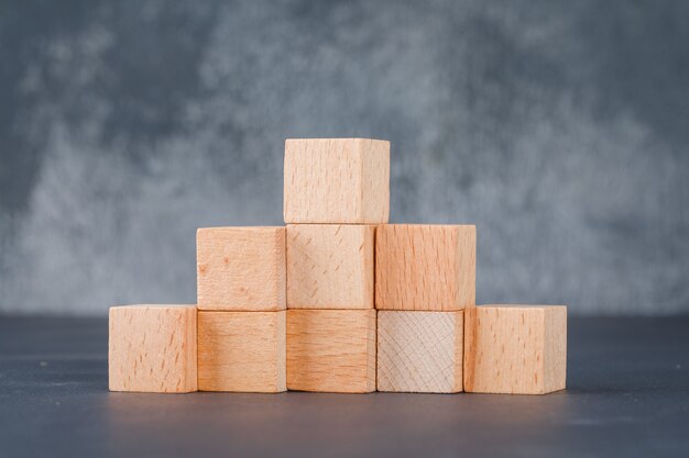 Business concept with wooden blocks like stairs.