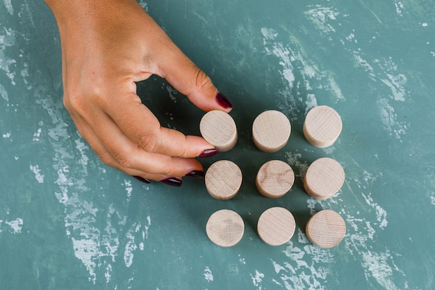 Business concept. woman holding wooden block.