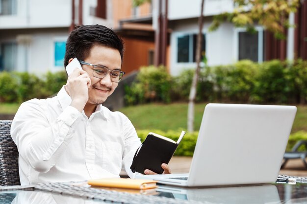 Business Concept - Young Business man woking on Financial plan. Strategy Analysis.