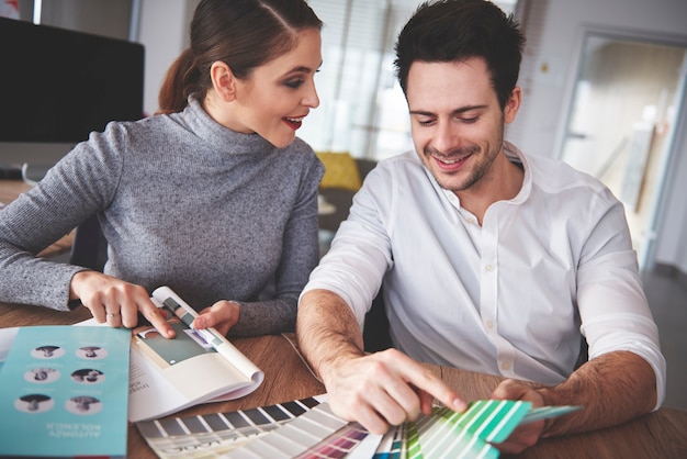 Business couple reviewing patterns at office