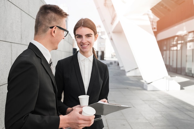 Business couple talking to each other