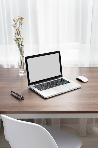 Business desk arrangement with laptop